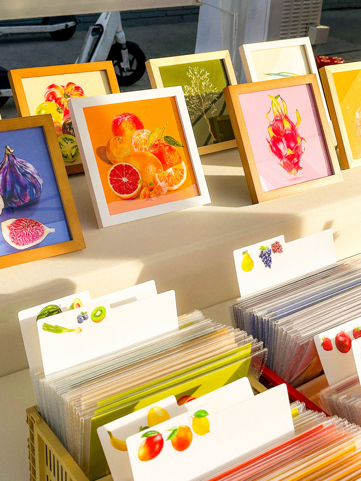 Fruit Stand cards and prints on a market table